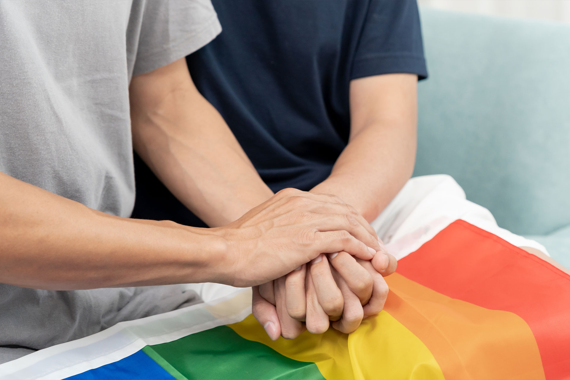 Two men holding hands